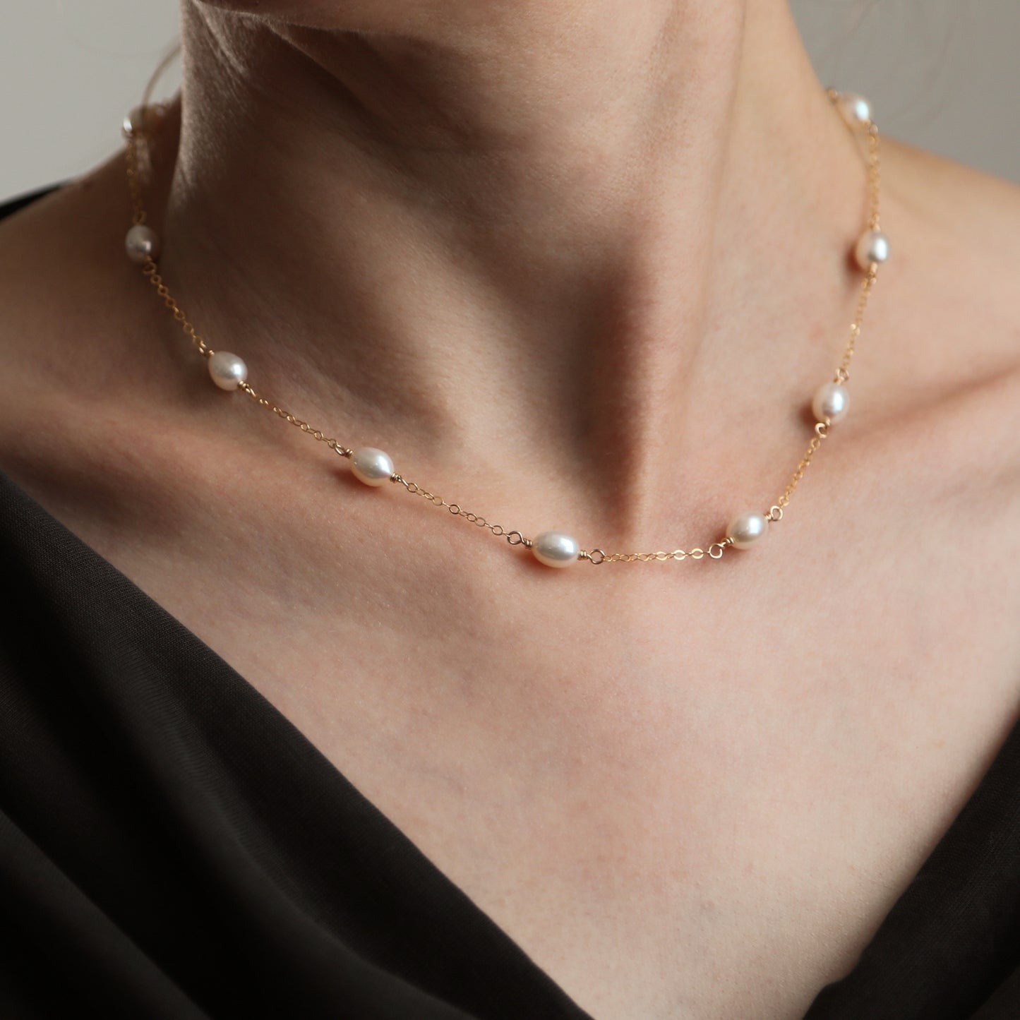 Gold pearl station necklace