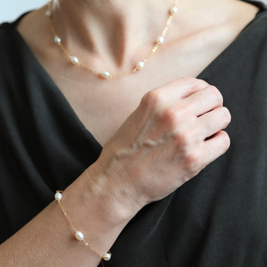 Gold pearl station jewelry