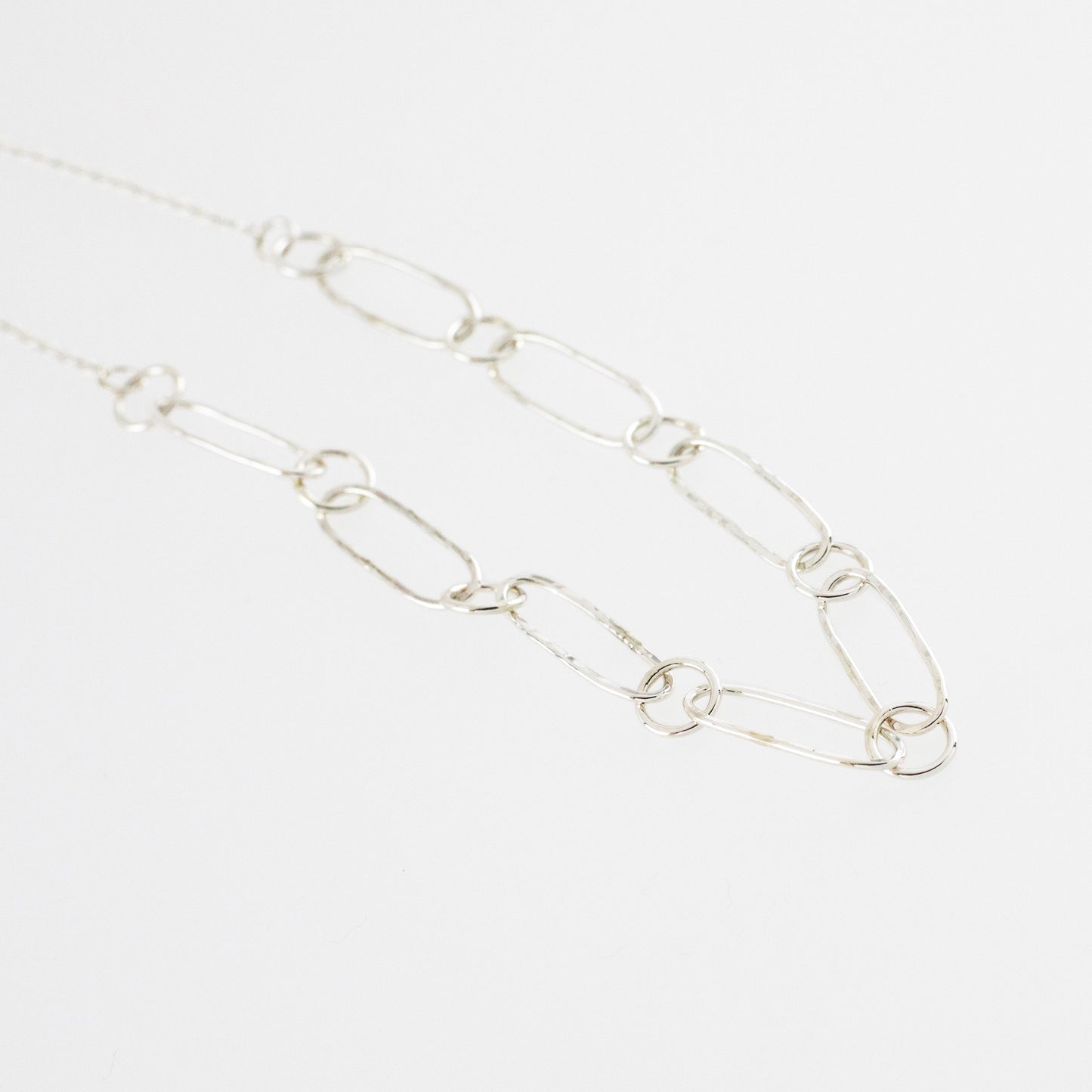 Detail of silver Paperclip chain