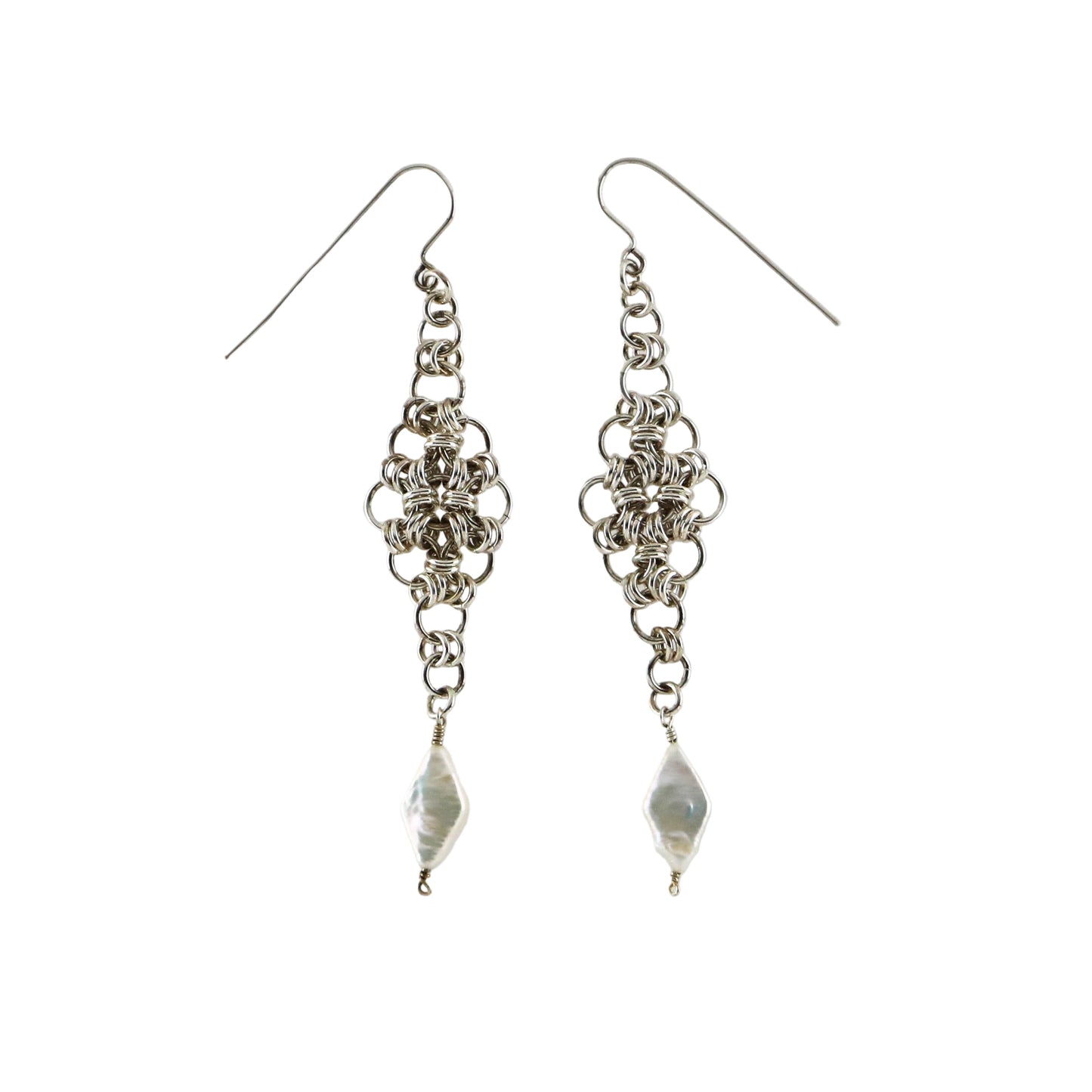 A pair of sterling silver chainmail earrings with freshwater pearl accents.
