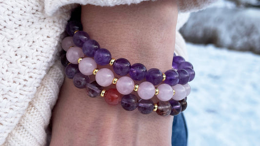 3 gemstone bracelets being worn together in a bracelet stack