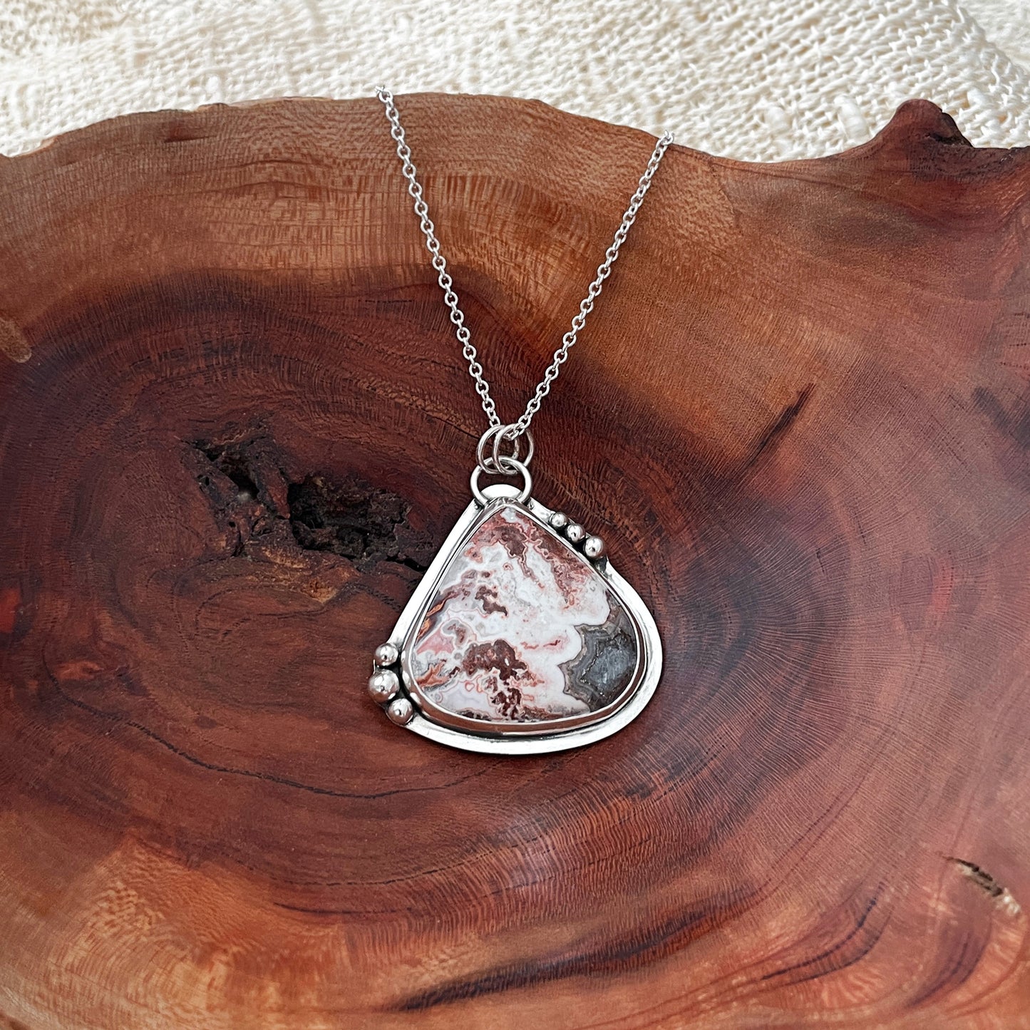 Agate cabochon set into a silver pendant
