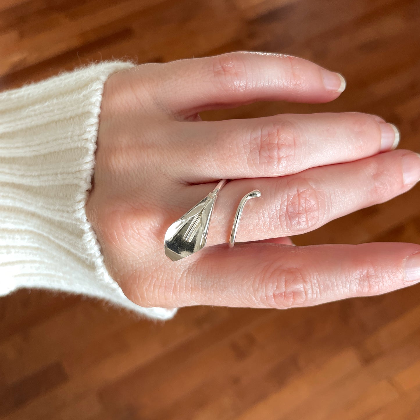 silver calla lily wrap around ring being worn