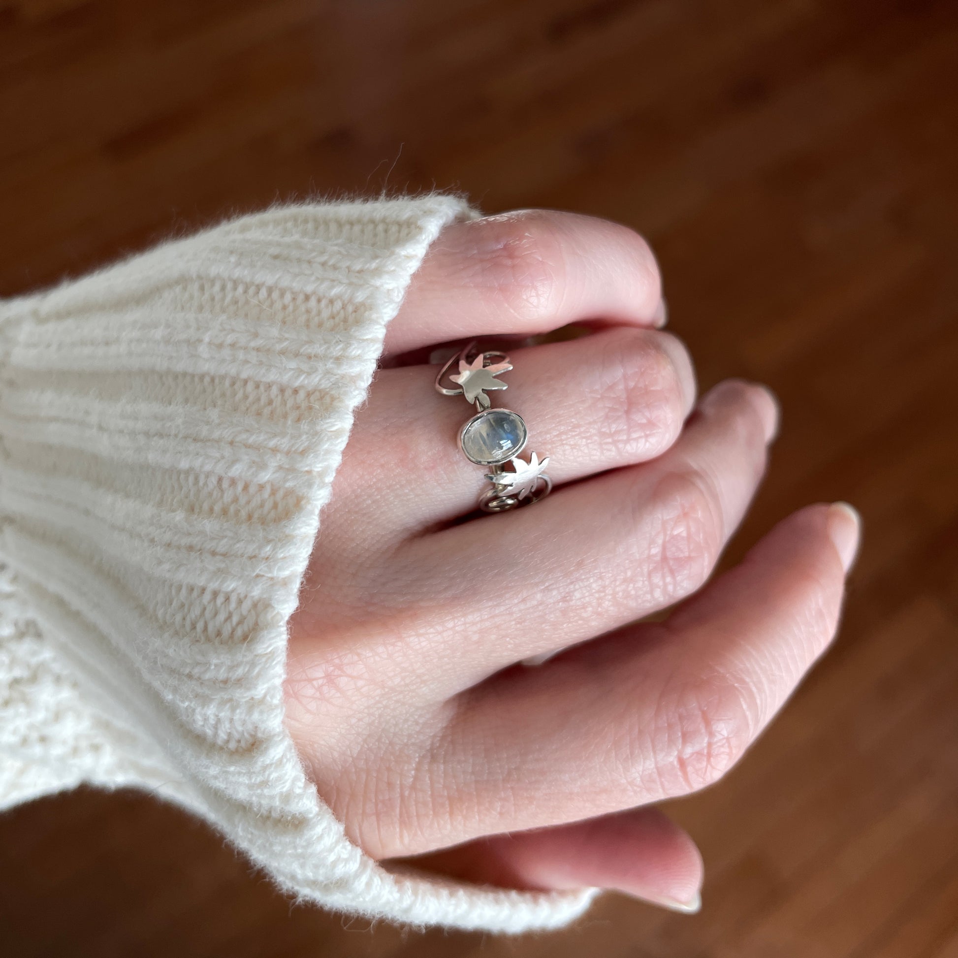 Moonstone ring with silver maple leaf accents