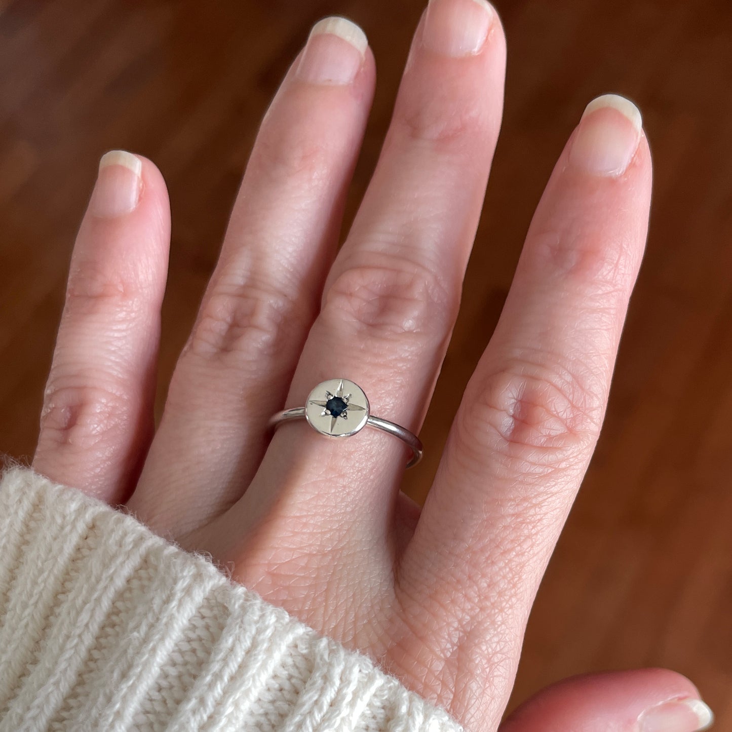 Silver ring with star set blue sapphire