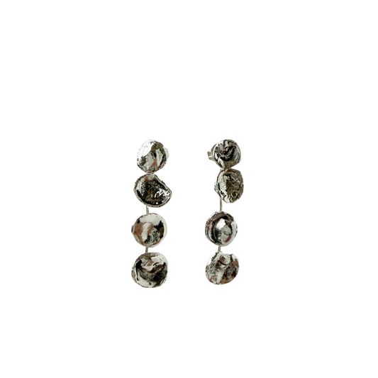 silver dangle earrings that look like drops of water 