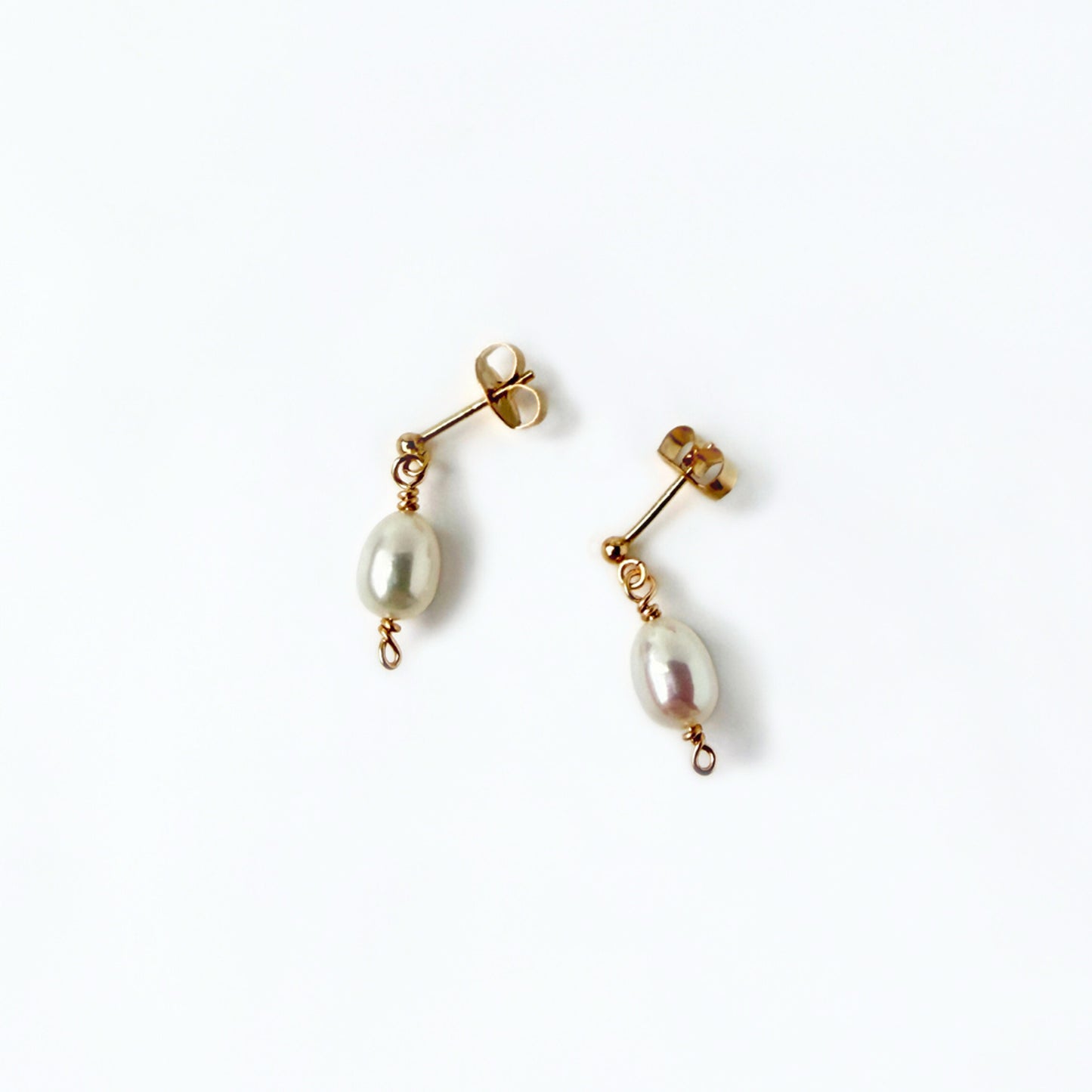 gold stud earrings with a freshwater pearl drop