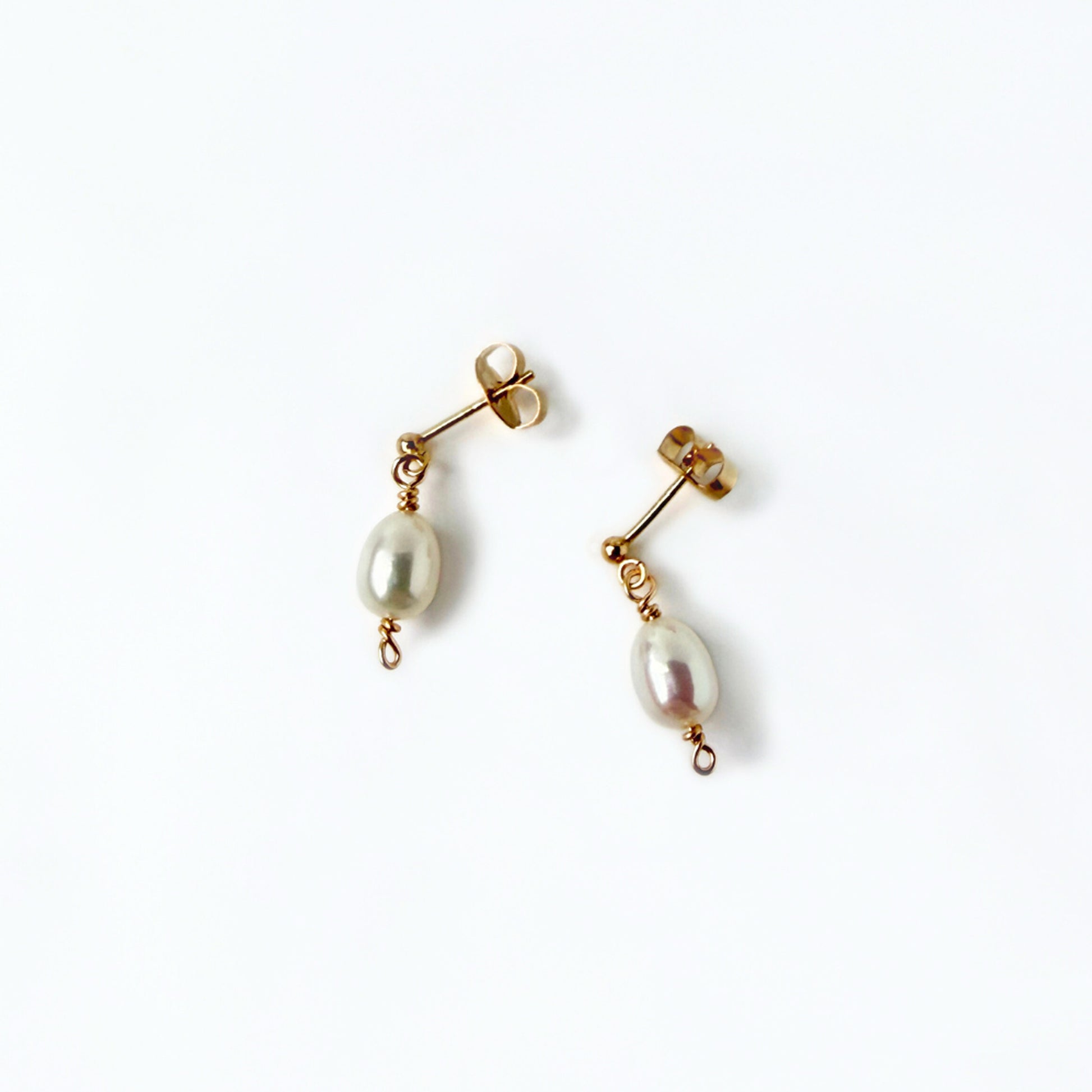 gold stud earrings with a freshwater pearl drop