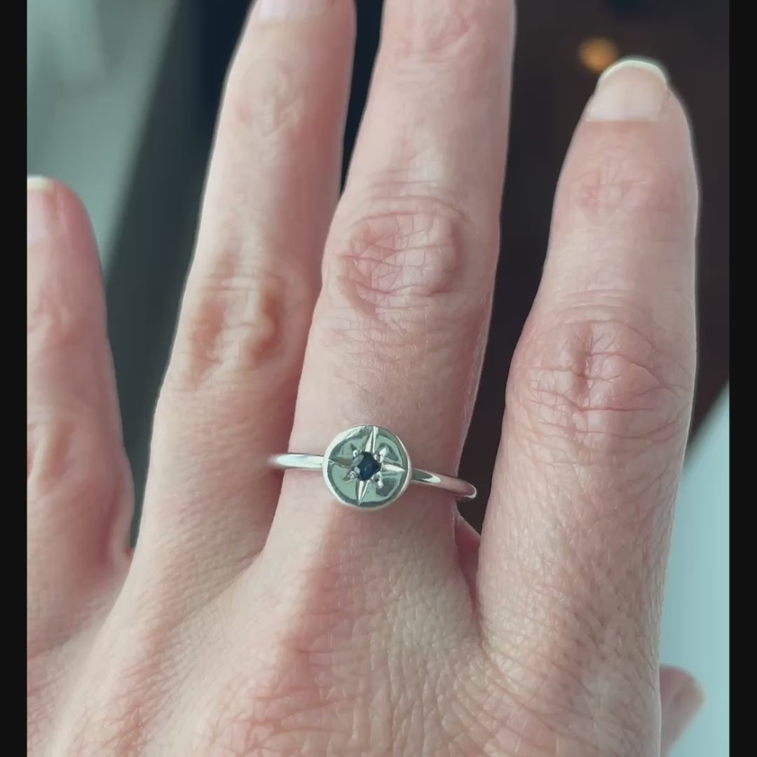 video of silver ring with a star set sapphire